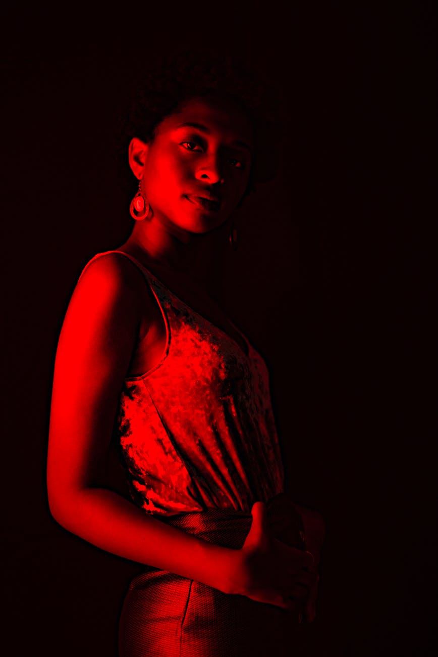 woman in brown shirt standing